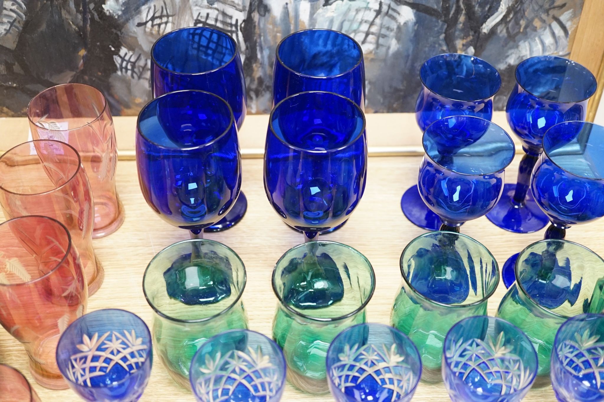 A mixed group of coloured glassware